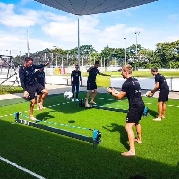 Group balancing on multiple Gibbon Slackrack Fitness setups outdoors