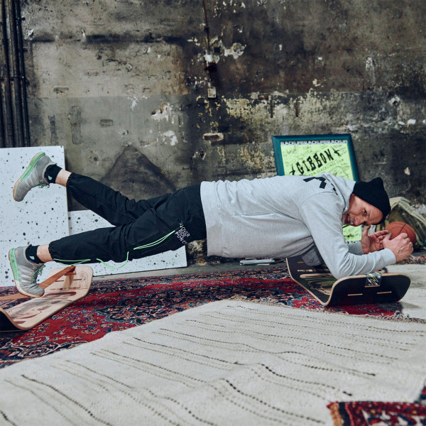 Person doing plank on two Gibbon Giboard Sets indoors