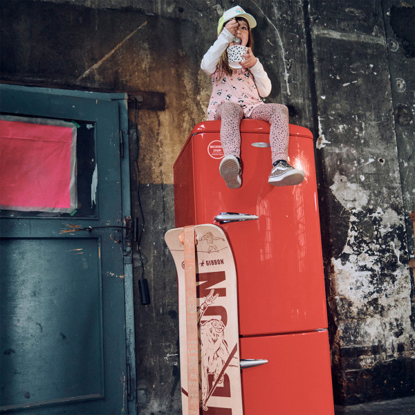 Gibbon Giboard Set Roots Rocker Travel next to a red fridge