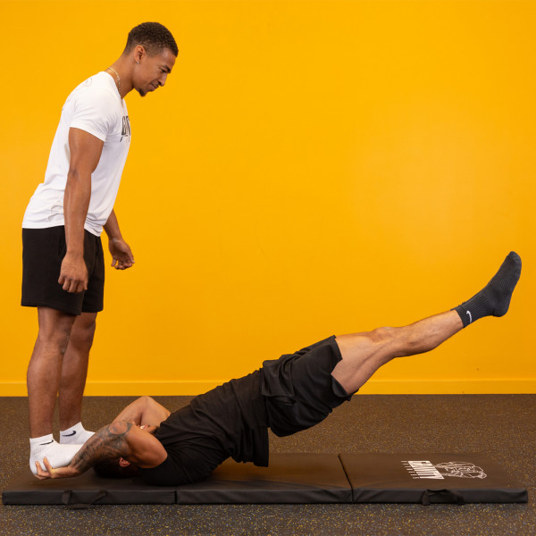 Lifestyle image of the Gravity Fitness Tri-Folding Fitness Mat - partner workout