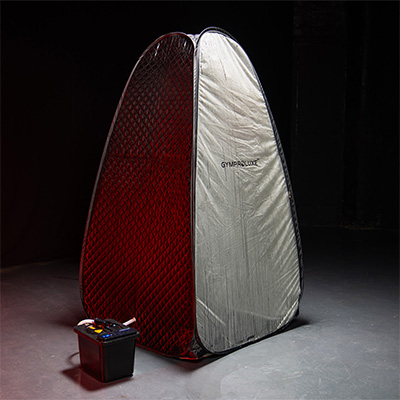 Lifestyle image of the GymProLuxe Tropical Sauna Pod set up against a black background.