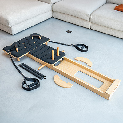Components of the Gymproluxe Portable Pilates Reformer laid out 