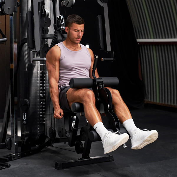 Image of the HAMMER Autark 2200 Multi-Gym with a model performing a leg curl