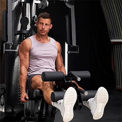 Image of a model performing leg extension on the HAMMER Autark 2200 Multi-Gym