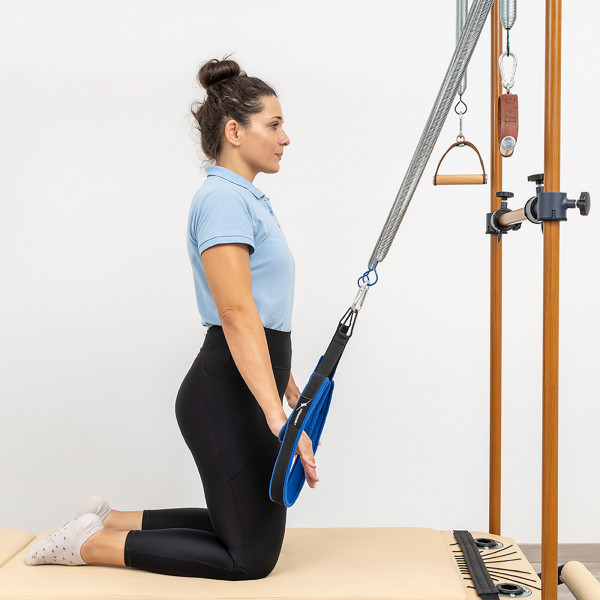 Kneeling spring-assisted pulldown on the HEGREN TALMA 62CR Cadillac Reformer