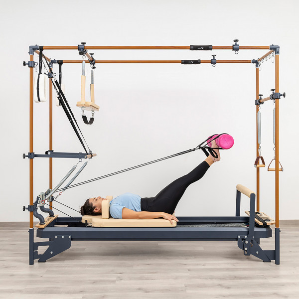 Leg press using resistance band and foot loops on the HEGREN TALMA 62CR Cadillac Reformer