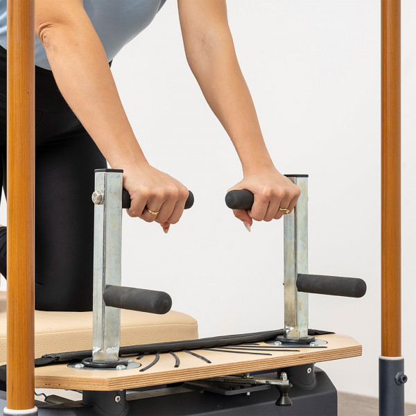 Close-up of the push-through bar grips on the HEGREN TALMA 62CR Cadillac Reformer