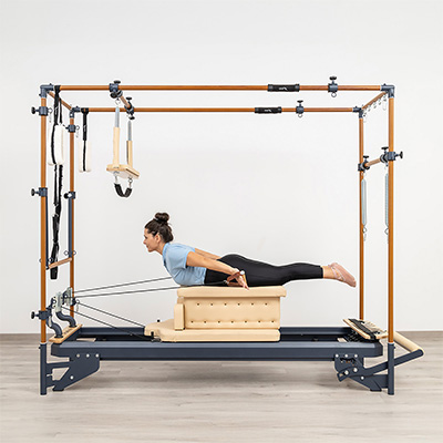 Swan exercise on long box with straps on the HEGREN TALMA 62CR Cadillac Reformer