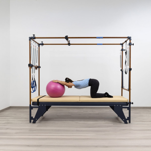 Stretch with Pilates ball on the HEGREN TALMA TRC Cadillac Trapeze