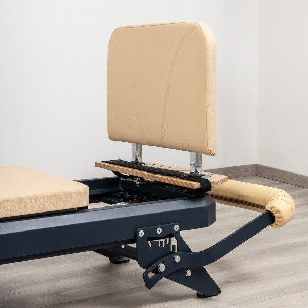 Close-up of the HEGREN TALMA Pilates Jumpboard - Beige in footbar slot