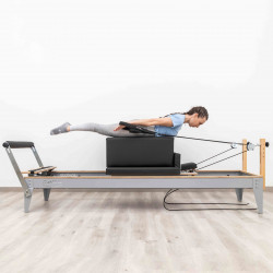 Side view of the HEGREN Modern Pilates Box in black during prone work
