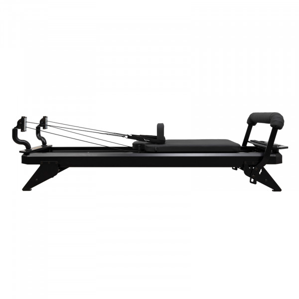 Side view of the HEGREN TALMA 62 Pilates Reformer - Black Frame/Black Upholstery