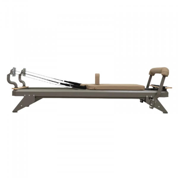 Side view of the HEGREN TALMA 62 Pilates Reformer - Quartz Grey Frame/Sand Upholstery