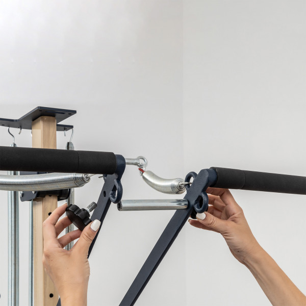 Close-up of spring-loaded push-through bar setup