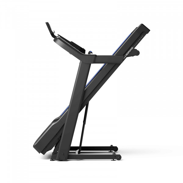 Product image of the Horizon 5.0AT Treadmill. The image features a white background product shot of the treadmill folded. This image is taken from the side.