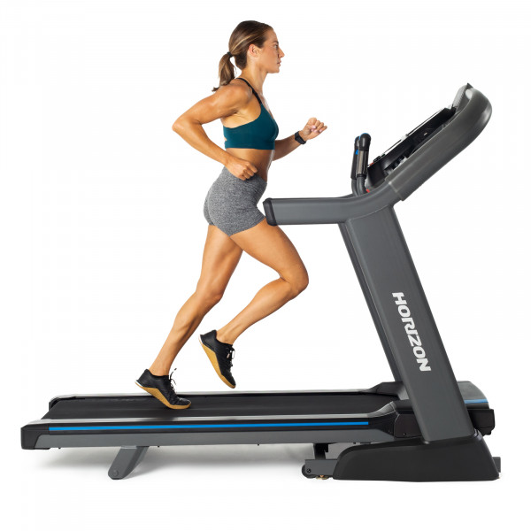 Person running on the Horizon 7.4AT Treadmill. 