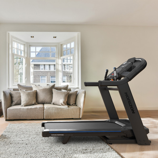 Horizon 7.4AT-24 Treadmill set up in a bright bay-windowed living room