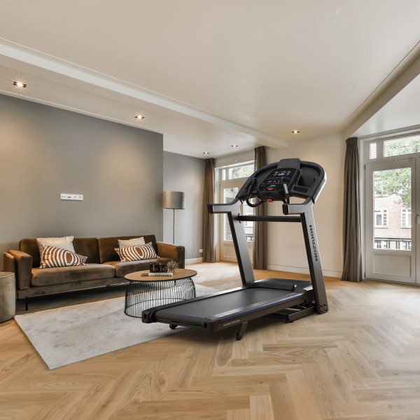 Horizon 7.4AT-24 Treadmill in a spacious lounge with wooden floors