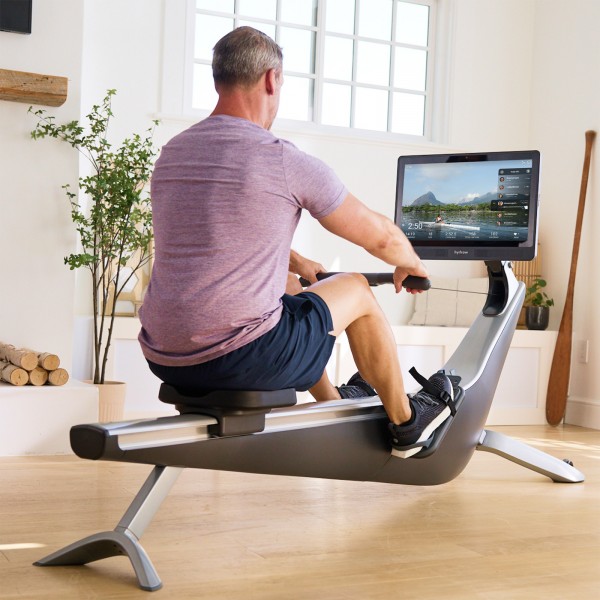 User working out on the Hydrow Pro Rower.
