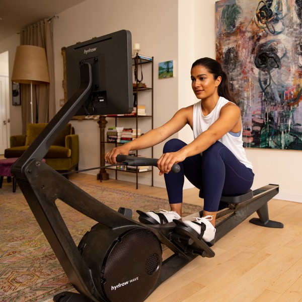 User exercising on the Hydrow Wave Rower.