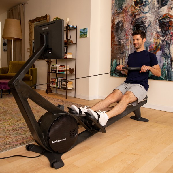 User in an intense session on the Hydrow Wave Rower.