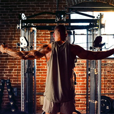 Image of a model performing cable crossovers with the SF6.