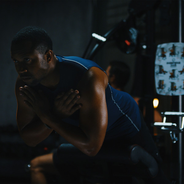 A person performing a back extension on the Inspire Fitness M5 Multi-Gym.
