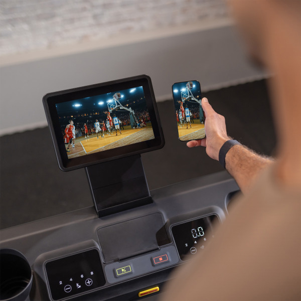 Smartphone screen mirrored to the Inspire Fitness Series T4S Treadmill console