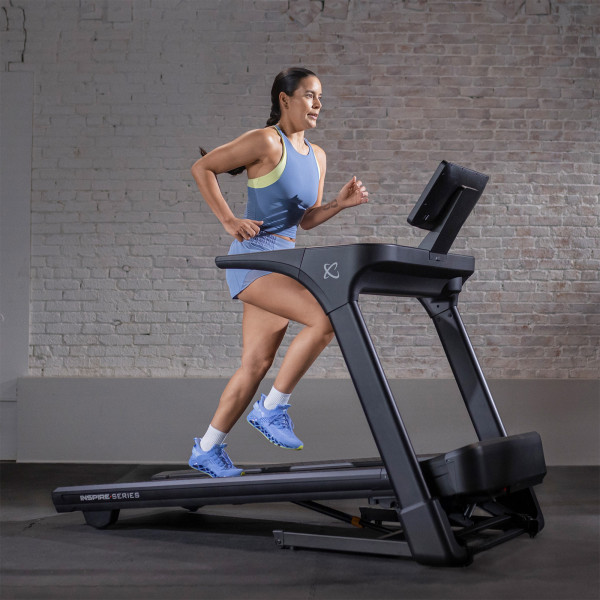 User running on the Inspire Fitness Series T5 Treadmill