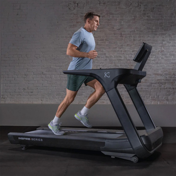 Person running on the Inspire Fitness Series T7 Treadmill