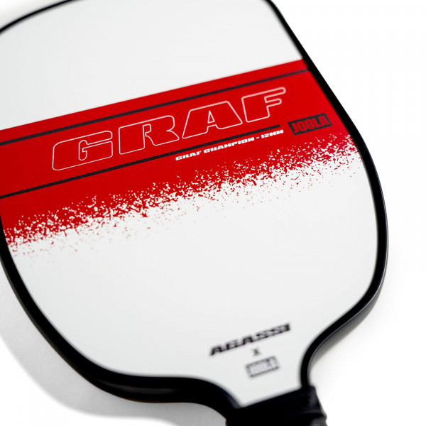 Close-up of the series name on the JOOLA Graf Champion 12mm Pickleball Paddle.