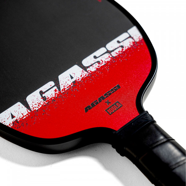 Close-up of the series name on the JOOLA Agassi Edge 16mm Pickleball Paddle.