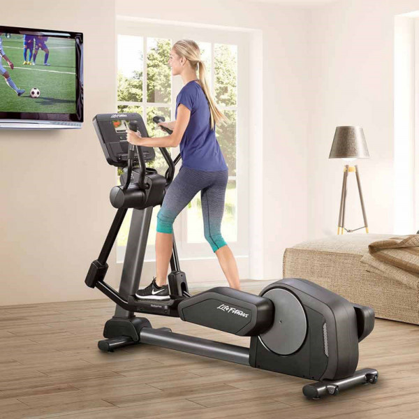 Person exercising on the Life Fitness Club Series Plus Elliptical Cross Trainer with the SL LED console.

