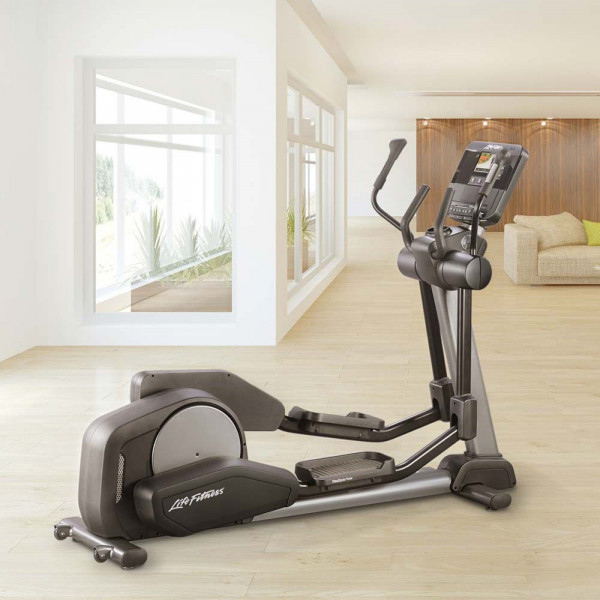 Side view of the Life Fitness Club Series Plus Elliptical Cross Trainer with the SL LED console in a home setting.