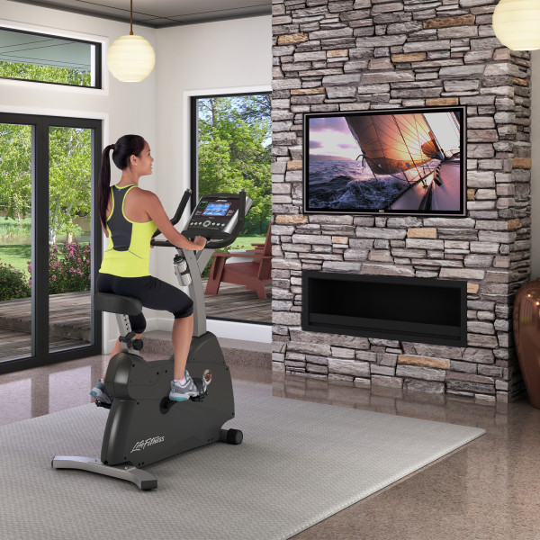 Image of a model riding the Life Fitness C3 Exercise Bike in a home setting