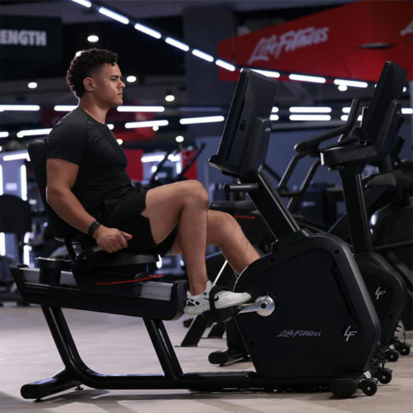 Person exercising on the Life Fitness Club Series Plus Recumbent Exercise Bike.