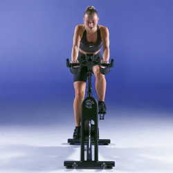 Person exercising on the Life Fitness IC3 Indoor Cycle Powered by ICG.