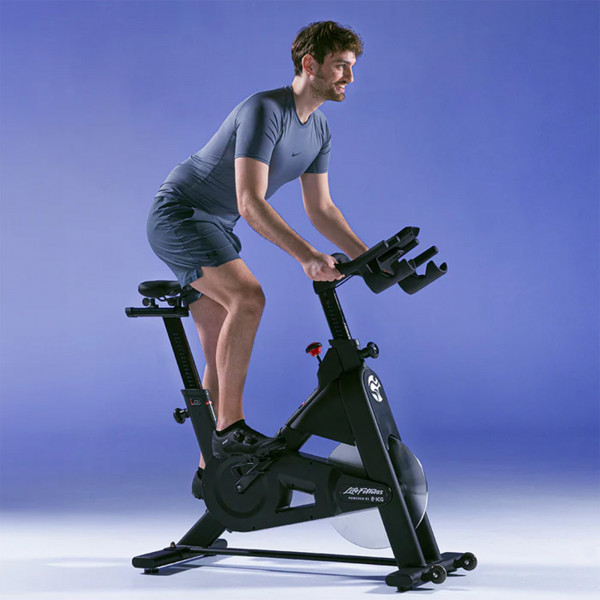 Person mid-workout using the Life Fitness IC3 Indoor Cycle Powered by ICG.