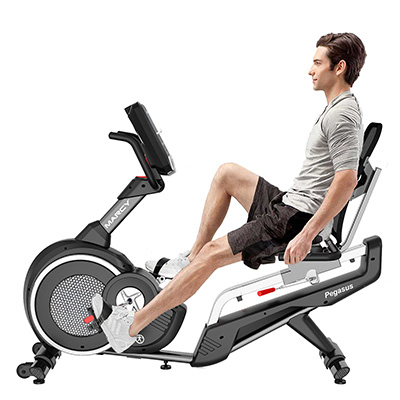 Model riding the Marcy Pegasus Premium Home Recumbent Bike using the seat-mounted heart rate sensors 