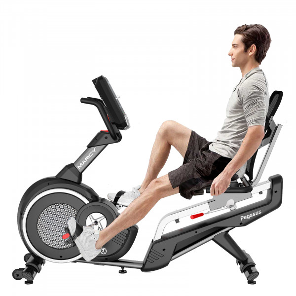 Model riding the Marcy Pegasus Premium Home Recumbent Bike using the seat-mounted heart rate sensors