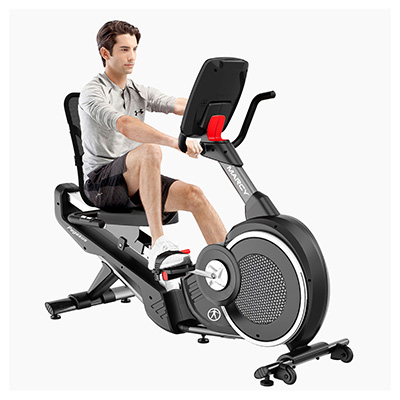 Model riding the Marcy Pegasus Premium Home Recumbent Bike with hands on the side handlebars 