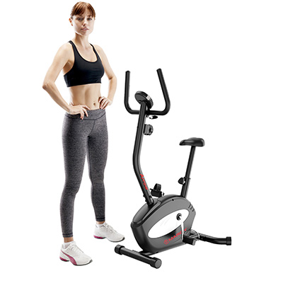 Model standing beside the Marcy Arrow Compact Upright Exercise Bike for size and scale reference