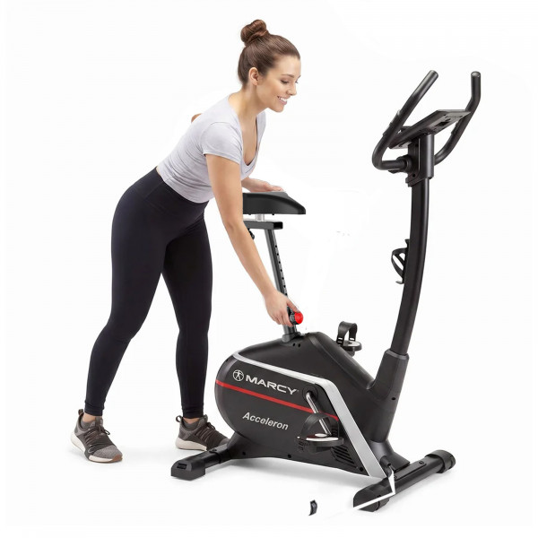 Model adjusting the seat height on the Marcy Acceleron Electro Magnetic Exercise Bike