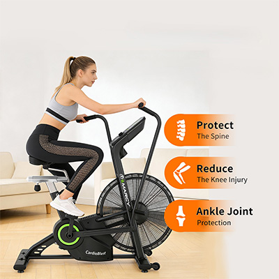 Model riding the Marcy CardioBlast Premium Home Assault Bike with graphics showing back, knee and ankle support 