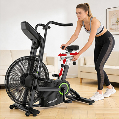 Model adjusting the seat position on the Marcy CardioBlast Premium Home Assault Bike with vertical and horizontal seat adjustments 