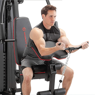 Image of a model using the Marcy MKM-81010 Home Multi Gym preacher curl