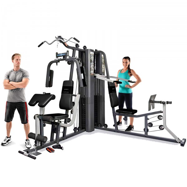 Two individuals getting ready to use the Marcy GS99 Corner Home Gym.
