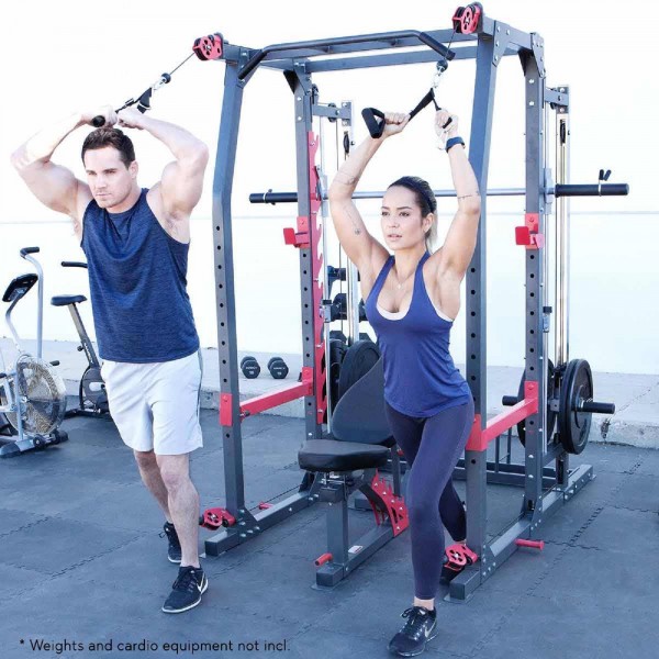 Two users in an active exercise session on the Marcy Pro SM-4903 Smith Machine.