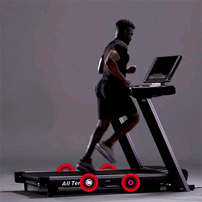 Model running on the cushioned deck of the Marcy All Terrain Power Fold Treadmill 