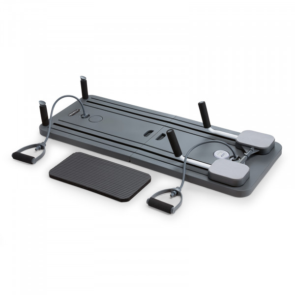 Angled view of the Marcy Pilates Core Trainer with included accessories